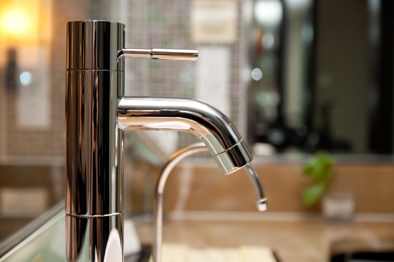 Leaking tap being repaired in South Lambeth